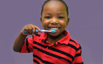 Child brushing teeth, happy dental hygiene.