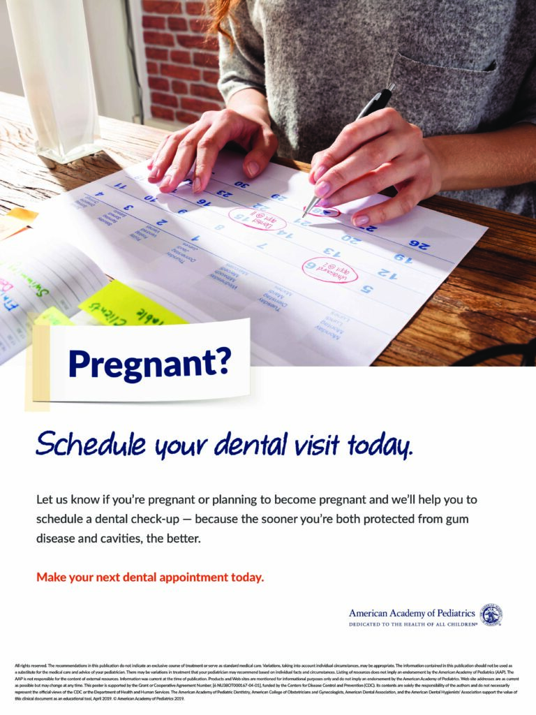 Pregnant woman scheduling dental check-up with calendar.